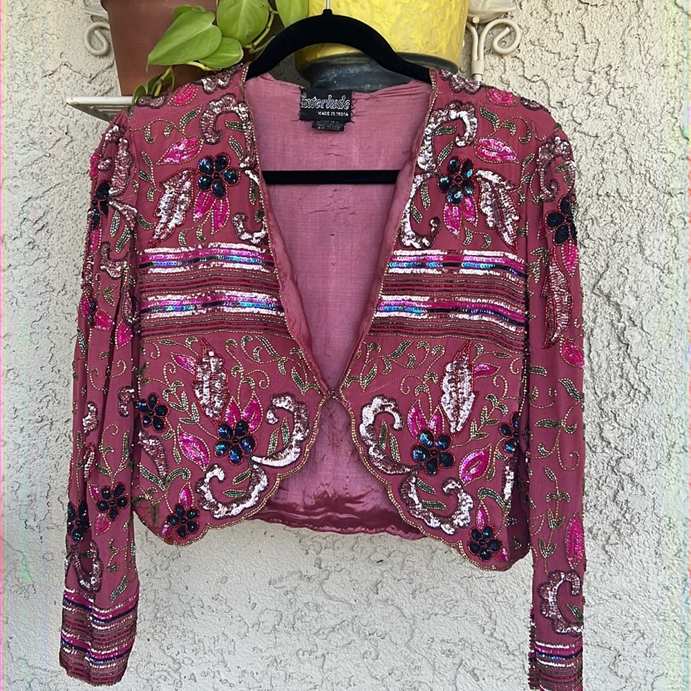 Vintage sequined silk jacket from the 70’s. Sequins in tact. Size S.